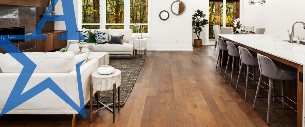 a living room with hardwood floors and a white couch