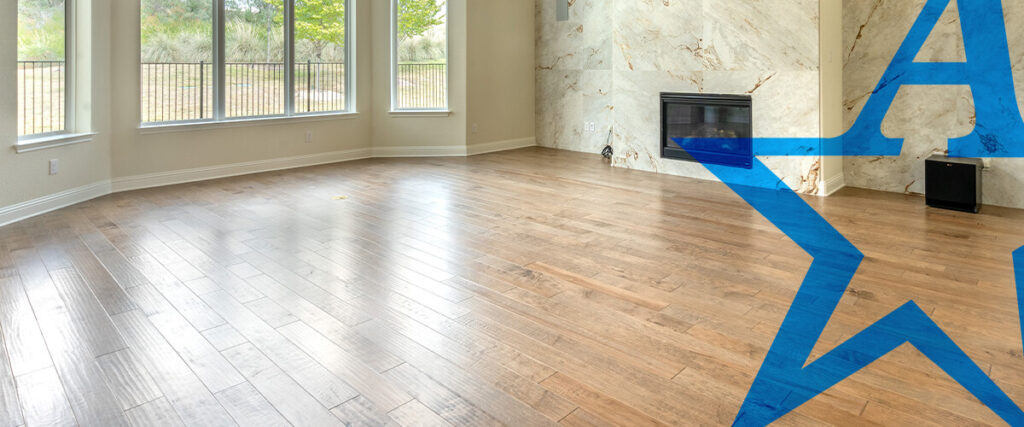 a living room with hardwood floors and a fireplace