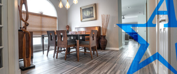 a dining room with a wooden table and chairs